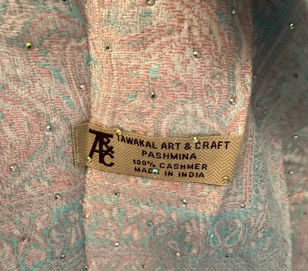 Pashmina with a brand label on a textured background